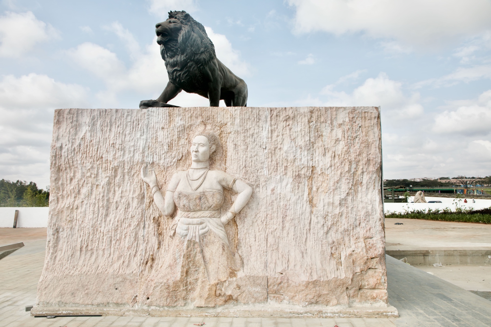 Mekatilili and Dedan Kimathi sculptures with lion monument at Uhuru Gardens